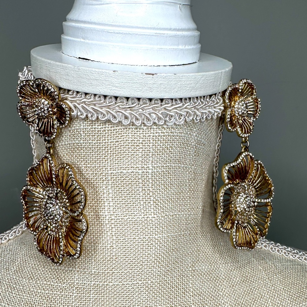 Gold earrings.
